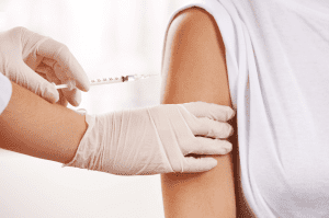 A patient receiving a B12 injection for energy and wellness.