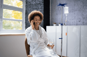 A relaxed athlete resting receiving an IV infusion in Salt Lake City.